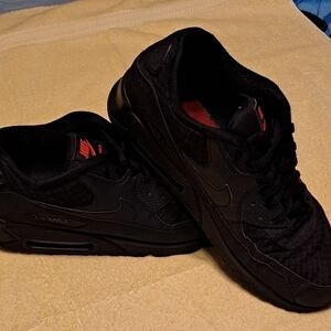 Black Nike Air tennis shoes